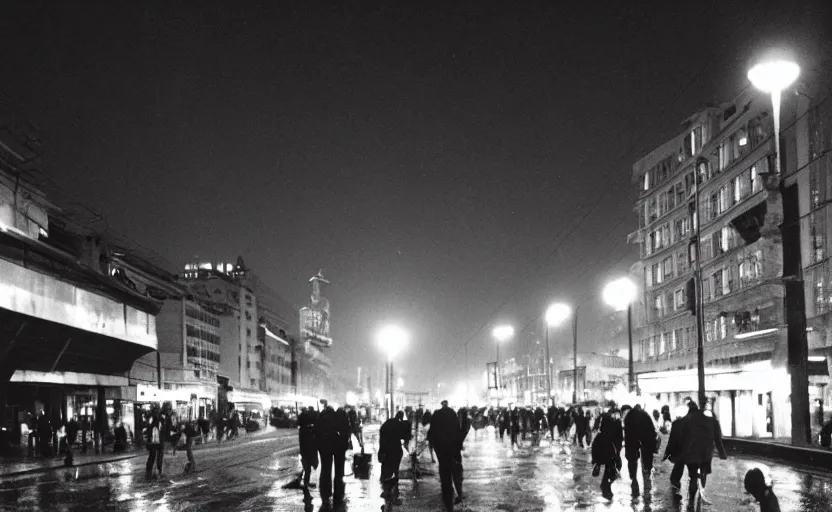 Image similar to 70s movie still of a soviet street with pedestrians with soviet high rise in the backround , Cinestill 800t 18mm beuatiful black and white, heavy grainy picture, very detailed, high quality, 4k panoramic, dramatic lightning, neon billboards and streetlight at night, rain, mud, foggy, big sculpture of Lenin on a square