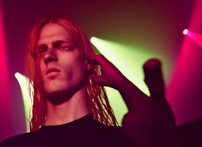 Image similar to waifish androgynous person with long blond hair on stage in front of a computer and alien instruments zeiss lens algorithm code masterpiece stage lighting photograph by wolfgang tillmans