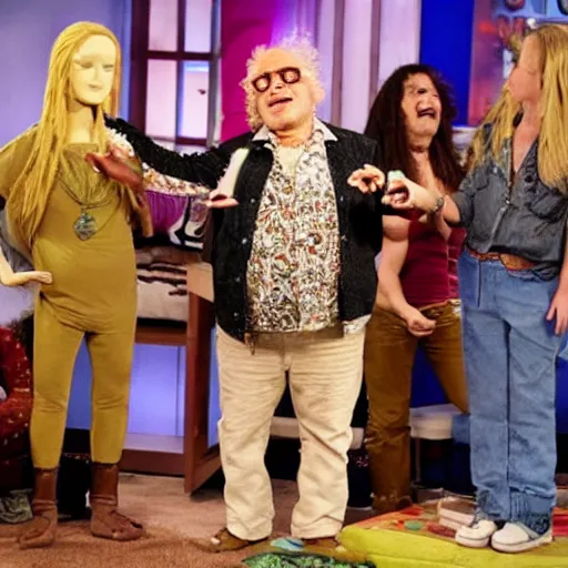 Prompt: danny devito hippy guest appearance on the elen degeneres show, plastic mannequins with cone shaped heads in the crowd, highly detailed facial expressions