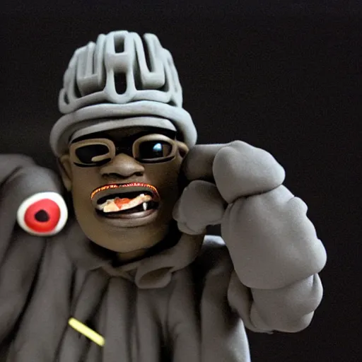 Image similar to a claymation film still of mf doom rapping. claymation by bruce bickford