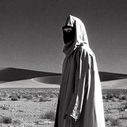 Image similar to a man wearing a long cloak and hood and gasmask, in the desert, film still, arriflex