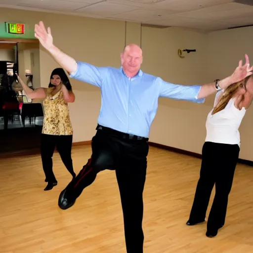 Image similar to Steve Balmer shows off his new dance moves at the club.