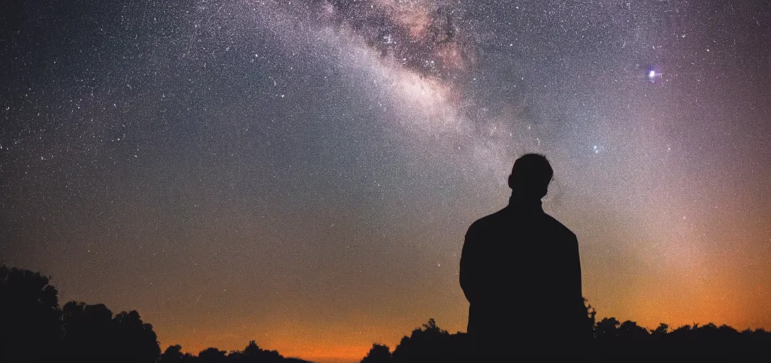 Image similar to silhouette of a man staring into the universe