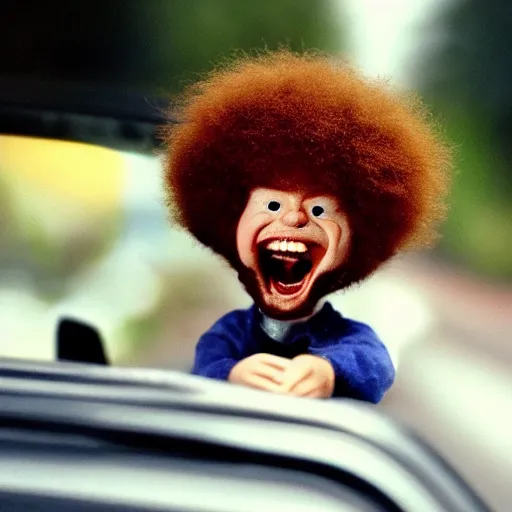 Prompt: a tiny screaming angry bob ross running your in rear view mirror, photograph