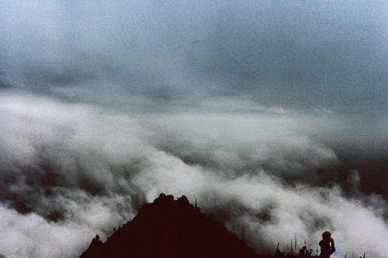 Prompt: gigachad on top of a tall mountain, blue fog, tornadoes surrounding, film photography, soft lighting, vignette