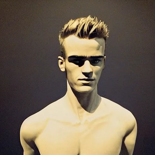 Image similar to “ a realistic detailed photo of a guy who is an attractive humanoid who is half robot and half humanoid, who is a male android, soccer player antoine griezmann, shiny skin, posing like a statue, blank stare, at the museum, on display ”