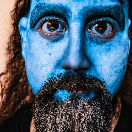 Image similar to fish eye lens close up photograph of a blue skin man with a goatee side eyeing the camera with a sympathetic look