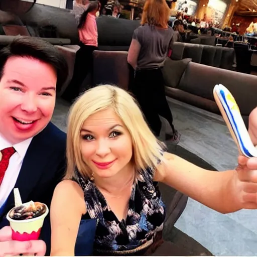 Prompt: Michael Mcintyre sitting next to a blonde woman eating ice creams & taking a selfie