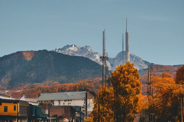 Image similar to warehouses lining a street, with an autumn mountain directly behind, radio tower on mountain, lens compressed, photography