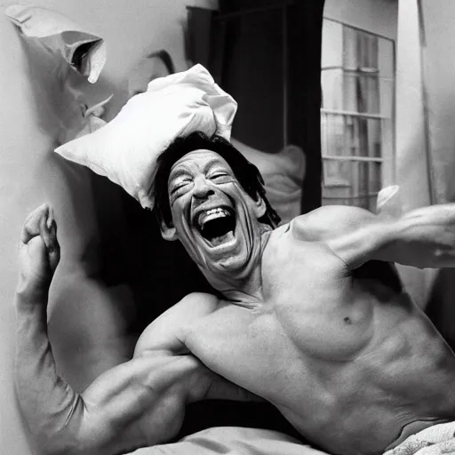 Image similar to jim varney has a nice new perm, he decides to have a pillow fight with jim varney in a white tank top. jim varney is on the bed pillow fighting with jim varney laughing having a great time playing with his jim award winning jim photography stunning hilarious pillow fight jim laughing