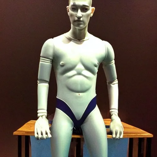 Image similar to “a realistic detailed photo of a guy who is an attractive humanoid who is half robot and half humanoid, who is a male android, American freestyle and folkstyle wrestler from Oklahoma Daton Fix, shiny skin, posing like a statue, blank stare, at college, on display”