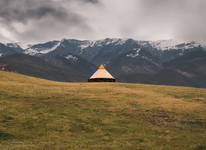 Image similar to a lone yurt on a hill overlooking cloudy mountains in the morning