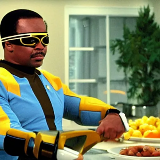 Image similar to Geordi LaForge wearing visor and a colander and random kitchen tools on his head