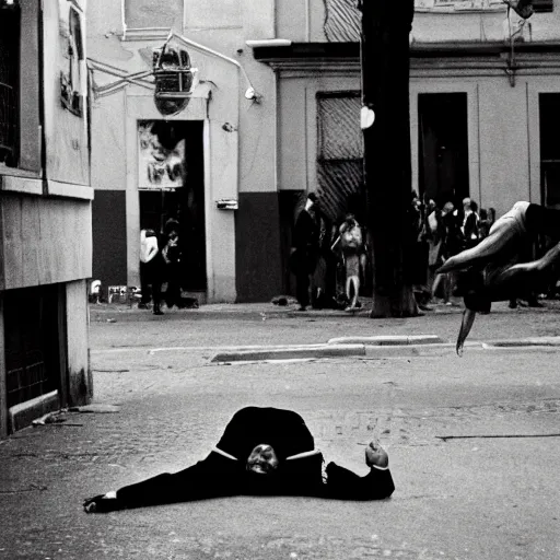 Prompt: A man on fire doing a backflip in the street, photographed by Henri Cartier-Bresson on a Leica camera