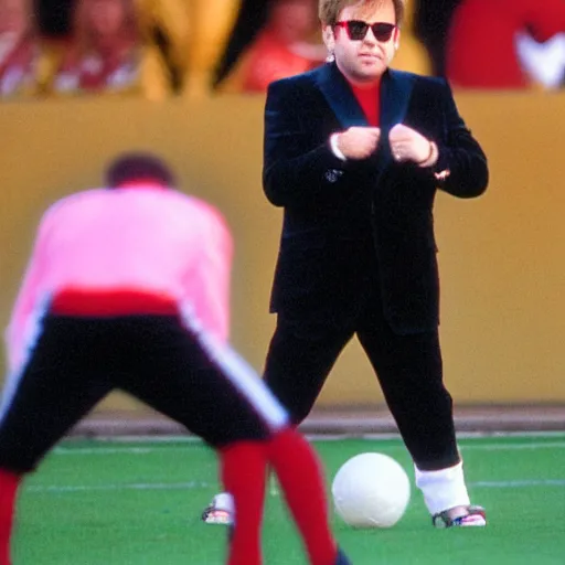 Prompt: Elton John plays football