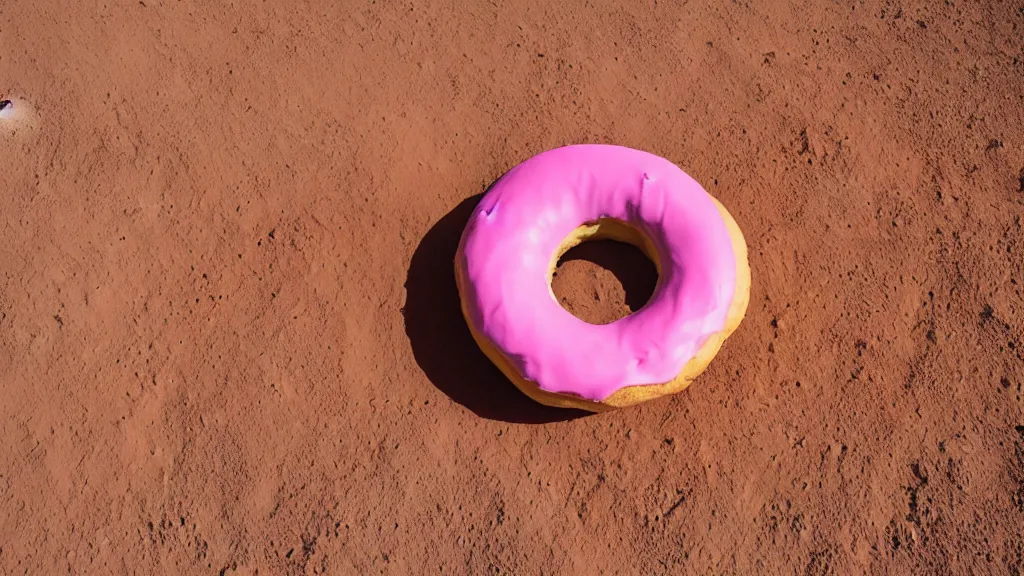 Prompt: giant donut with pink glaze on mars, sunlight, f - stop, high quality photography,