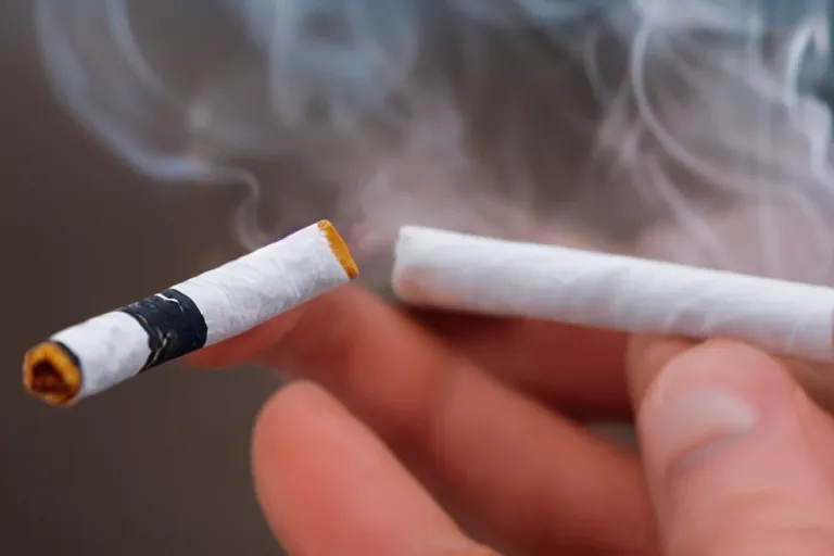 Image similar to Close-up of thin soft hand holding cigarette with smoke, hyper realistic, high details, photo, super resolution