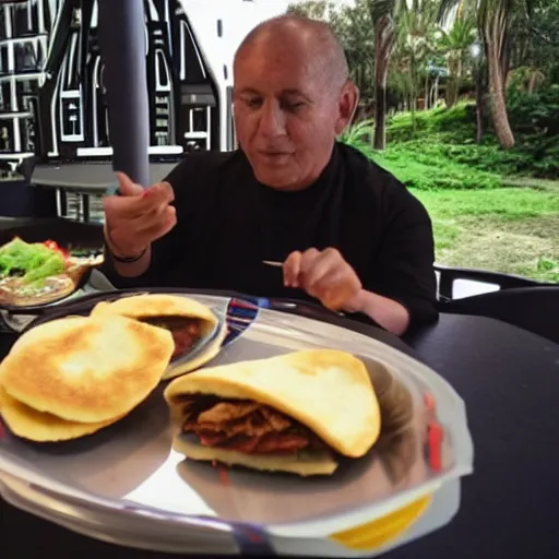 Image similar to A still of Darth Vader eating arepas, 4k, photograph, ultra realistic, highly detailed, professional lighting