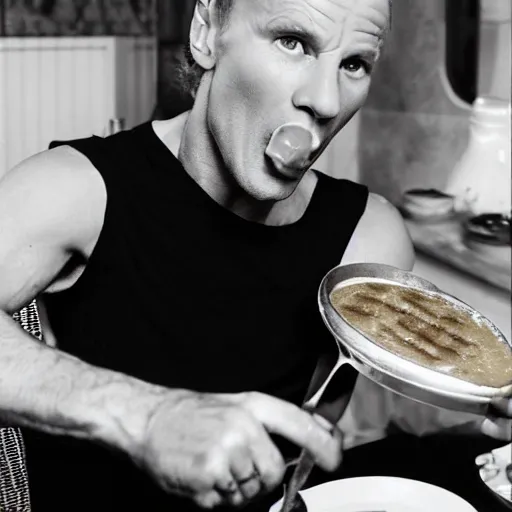 Image similar to sting the singer eating a banana creme brule ( dont ask )