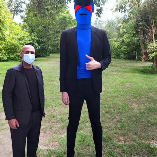 Image similar to the tallest man alive compared to Elon Mask