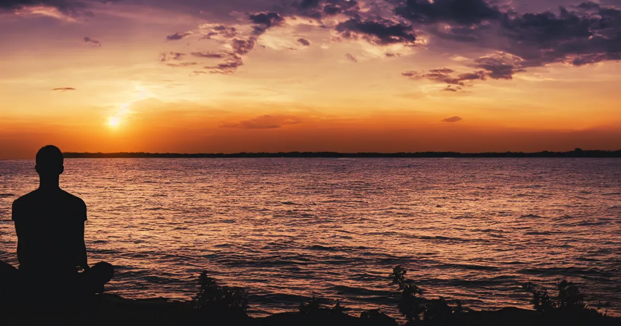 Prompt: wide range photo silhouette of a man meditating, at a beautiful sunset, highly detailed, colorful,