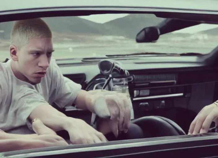 Image similar to a very high resolution image from a new movie, eminem driving a car. mountains, directed by wes anderson