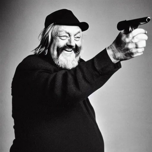 Image similar to laughing robert wyatt with mouth wide open pointing a gun directly at the camera