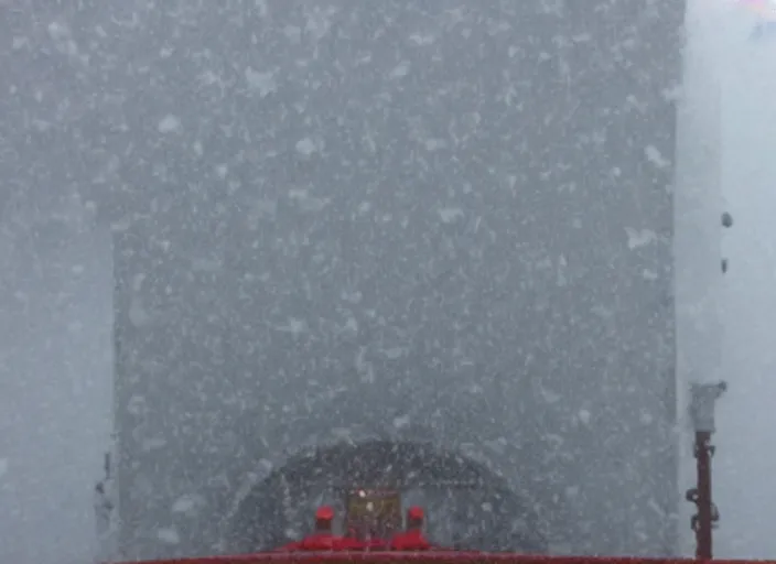 Prompt: Inside the bridge of a ship in a severe storm, emergency