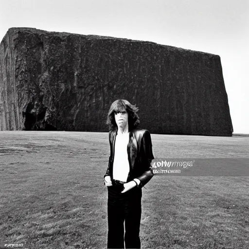 Prompt: mick jagger in front of a huge black monolith, monolith landscape, from the movie 2 0 0 1 a space oddisey directed by stanley kubrick, detailed photo,