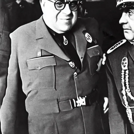 Image similar to 1942 photograph of Danny DeVito in a Nazi officer's uniform standing next to Adolf Hitler