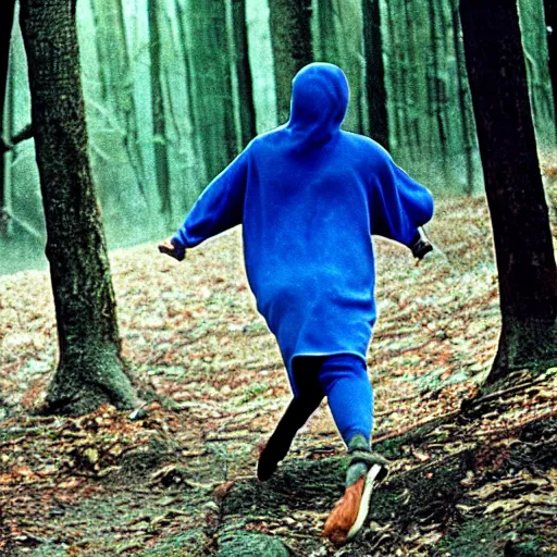 Prompt: man wearing blue hood kicking a witch in a forest, 1 9 9 1, movie still