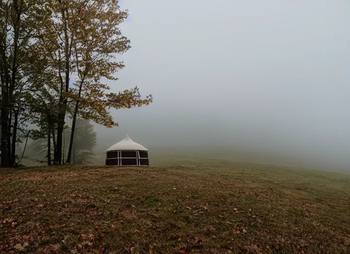 Image similar to a lone yurt on a hill overlooking the blue ridge mountains on a foggy morning