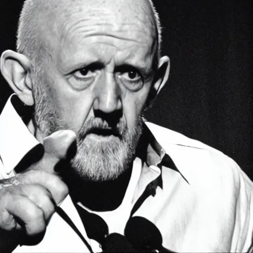 Prompt: mike ehrmantraut pretending to be george carlin on stand up night