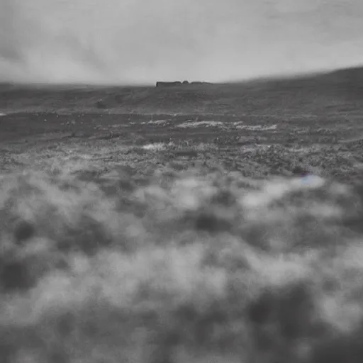 Image similar to a ww 2 photo of a battlefield in iceland. grainy, black and white, overcast sky.