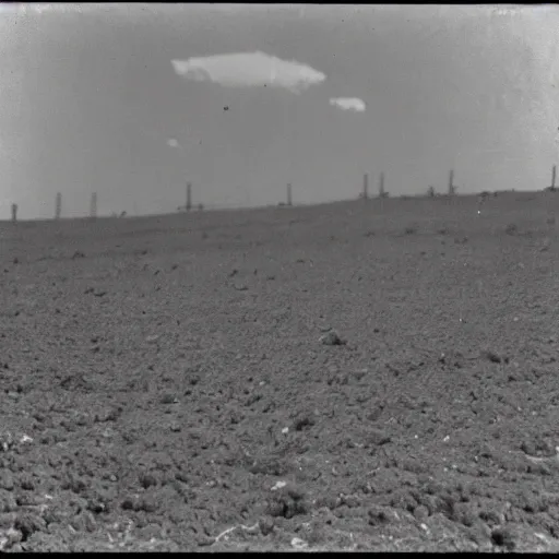 Prompt: a bright flash covering the whole sky, dirt ground, dust, taken on a ww 2 camera, realistic.