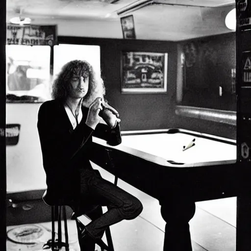 Prompt: photo of Jimmy page sitting on barstool in a dive bar, pool table in the background, he is smoking a cigarette, a beer bottle sits on the bar next to him, award winning, high quality n 6