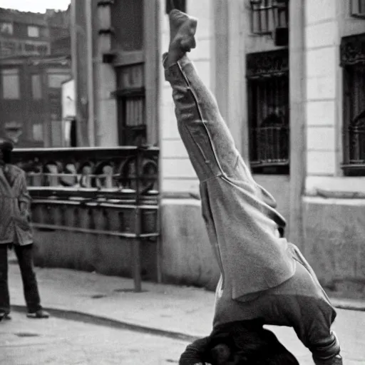 Prompt: A man doing a backflipping in the street, stunning, eye-catching , dramatic, photographed by Henri Cartier-Bresson on a Leica camera