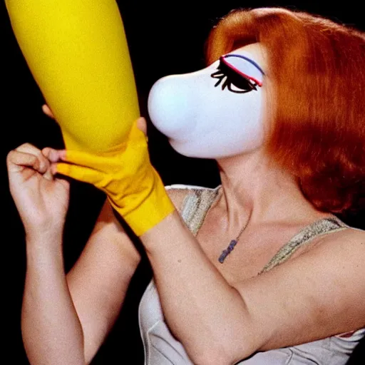 Image similar to 1970 woman on tv show wearing a mask with a long prosthetic nose, prosthetic eyeballs, wearing a leotard on the hillside 1970 color archival footage color film 16mm holding a hand puppet Fellini Almodovar John Waters Russ Meyer Doris Wishman