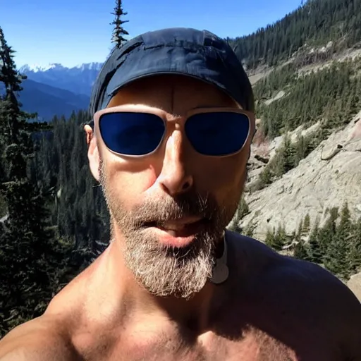 Prompt: 4 0 - year - old, bald, french man from louisiana, fit build, hiking in washington, wearing sunglasses
