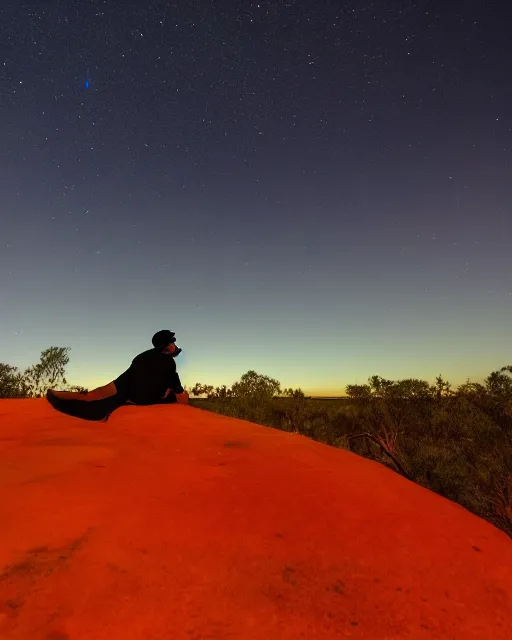 Image similar to man sitting at uluru, medicine drum, night sky, small fire, cosmic sky