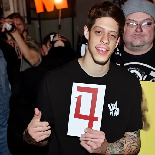 Image similar to pete davidson holding up a card that says 1 1 1 1 1 1 1 1 1