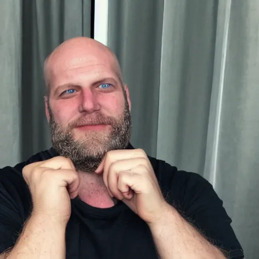 Prompt: a real photograph of Ethan Van Sciver with a pointed nose, bald head and grey beard