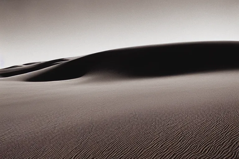 Image similar to a cinematic photograph of a sand wave in a serene vast desert, dune, cinematic, movie still, dramatic lighting, by bill henson, 1 6 : 9 ratio