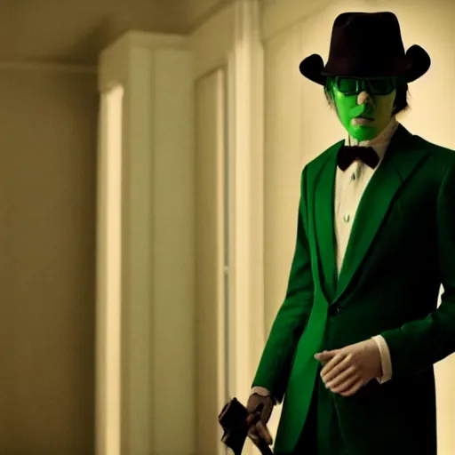 Image similar to film still of Paul Dano as Riddler in a green suit and tie and green fedora in a dark room in The Batman, 4k, dark lighting!!!!, film noir, grainy, dark tone