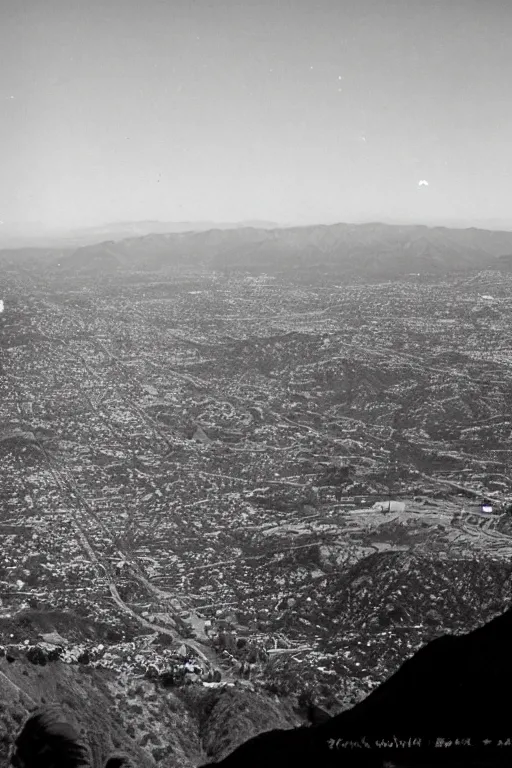 Prompt: retro photograph taken from hill of giant crack!!!!!! in the sky above southern california city