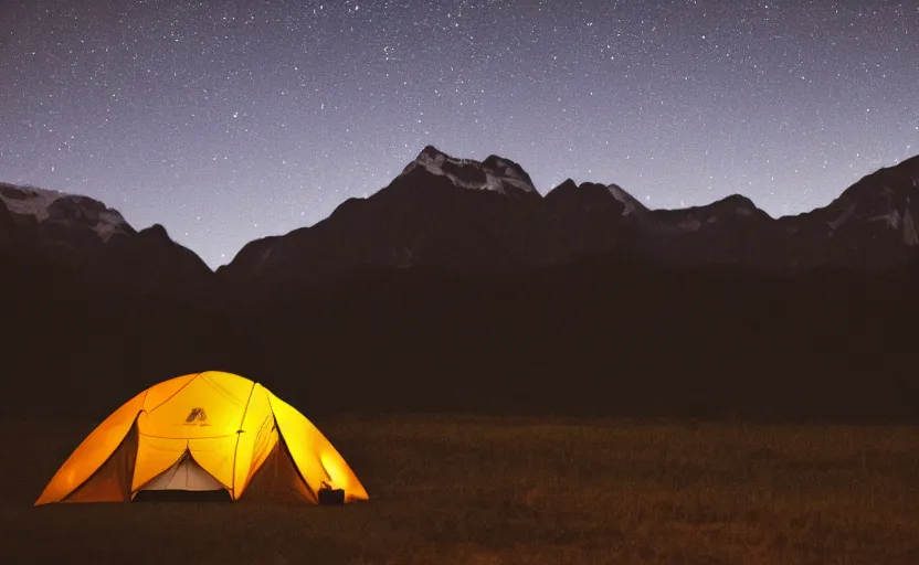 Prompt: night photography of a tent with mountains in the background