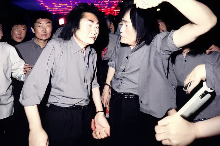 Prompt: a middle aged chinese dj with thick hair, wearing black trousers and grey shirt, in a nightclub. by david lachapelle