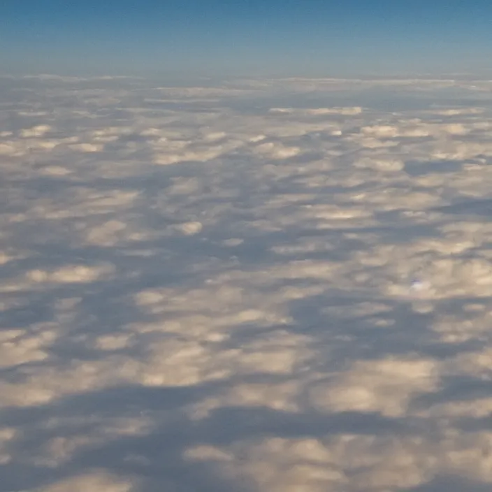 Image similar to Endless clouds towering high, seen from a plane, no ground visible, very detailed, 8k resolution, pale yellow hue with brown shadows