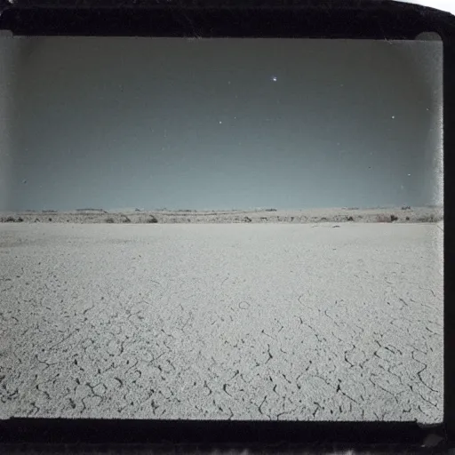 Prompt: a slot machine in the distance in the middle of a desert at night, very dark, dark lighting, old polaroid, damaged film, expired film, slightly blurry, liminal space, surreal,