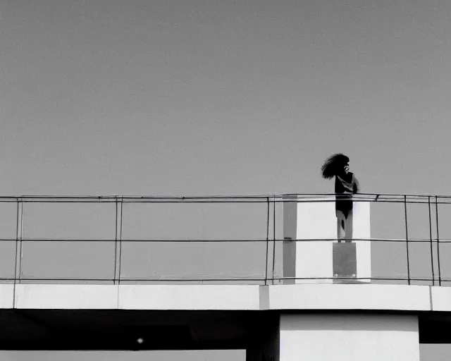 Prompt: a still of a woman standing on a huge brutalist white balcony, outside view, clear sky, minimalist composition, music video (1985)